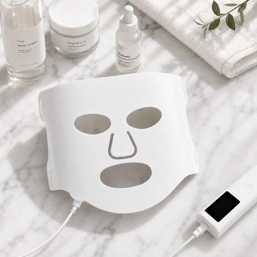 Orvee LED Face Mask on marble flat lay